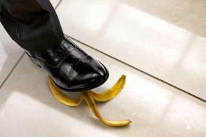 men shoe stepping on banana peel